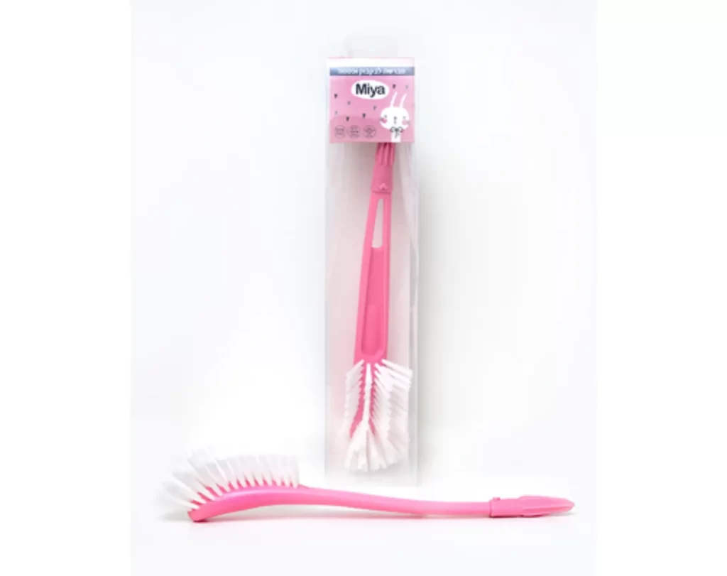 A pink cleaning brush for a bottle